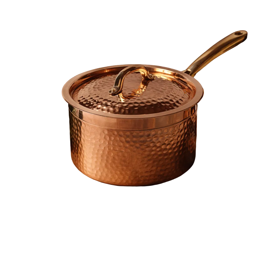 Hammered copper saucepan with brass handle and lid